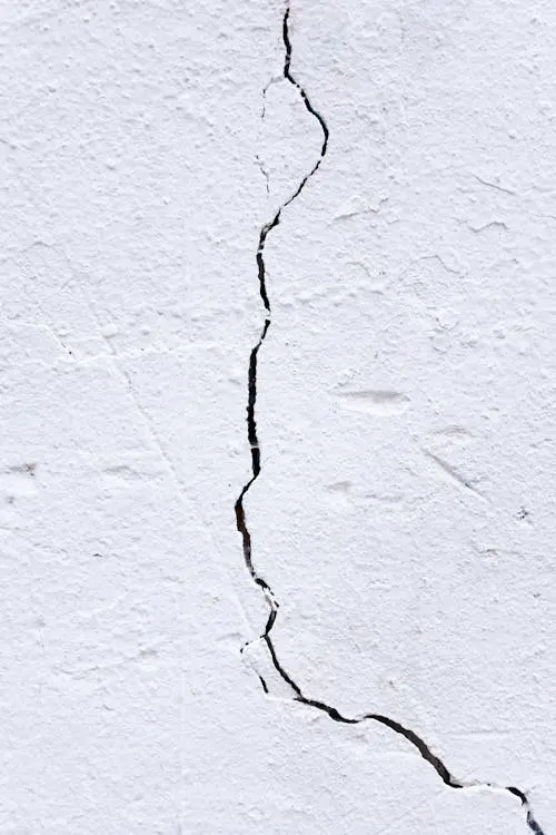 Wall crack, a great sign to consider repainting the exterior of a house in Oklahoma City, Edmond or Moore