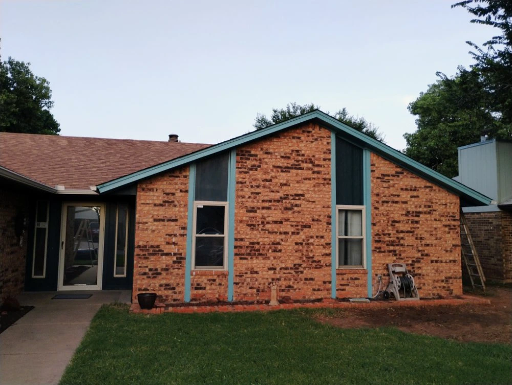 Exterior house thermal blue painting in Edmond, Oklahoma