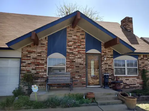 Exterior house white and black painting in Oklahoma City